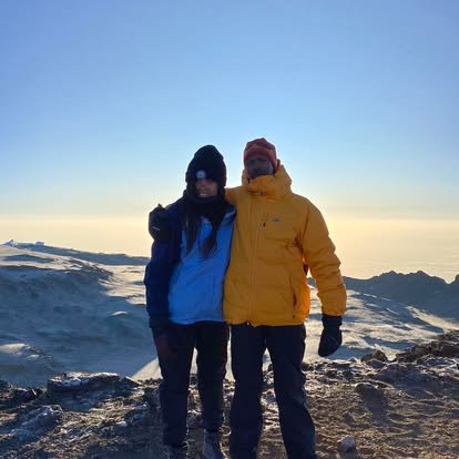 Dad and daughter on top of Kilimanjaro